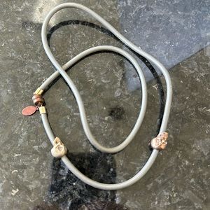 Magnetic closure wrap bracelet with skull charms